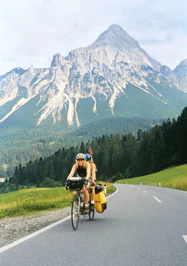 Photo courtesy of Eber family / Paula and Anya Eber cycle over the Alps. Members of the Eber family close the 2023 Travelers Journal series on March 30 with their presentation, Cycling around the world with children: A family pedals across 4 continents and 24 countries for asthma.