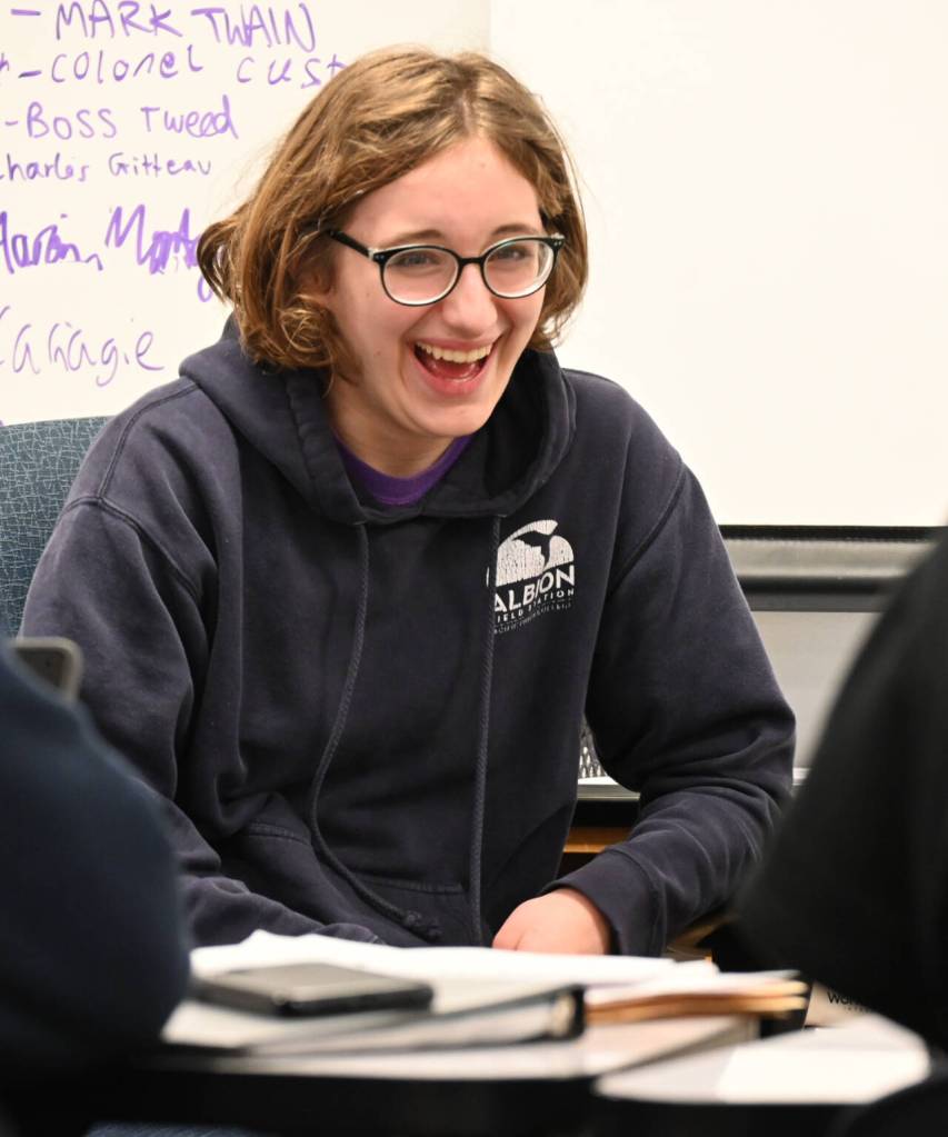 Sequim High student Georgia Bullard shares a lighthearted moment with fellow Mock Trial club members during a practice last week.