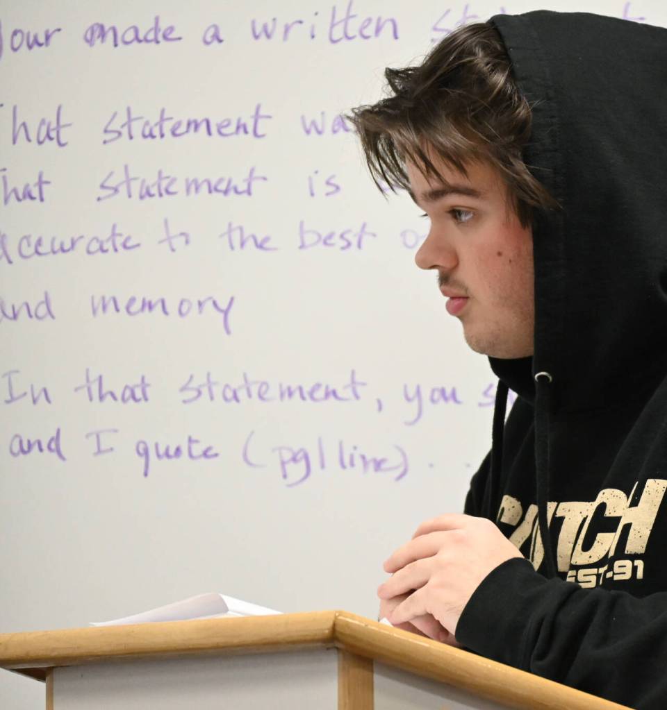 Sequim Gazette photo by Michael Dashiell / Finn Marlow scrutinizes a witness during a Mock Trial club practice last week.