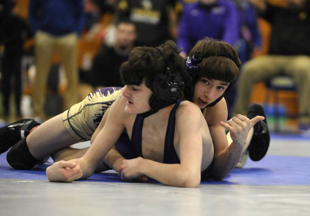Sequim Gazette photo by Michael Dashiell / Sequims Cayden Beauregard, top right, takes on North Kitsaps Nolan Hancock at a sub-district tournament in Bremerton on Feb. 4. Beauregard won the match by technical fall (18-3) and took first place overall at 106 pounds.