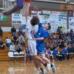 Sequim Gazette photo by Emily Matthiessen / Sequim's xxxxxx xxxxxxxx, left, looks to score as North Mason's Nolan McGanney guards the basket.