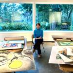 Submitted photo / Archivist Jana Kelly sits amongst parts of the Port Angeles Fine Arts Centers Esther Webster collection.