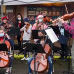 Sequim Gazette file photo by Emily Matthiessen
Members of Sequim Community Orchestra, with youth from their strings program, play holiday favorites at the Home Town Holidays event in Sequim in 2021.