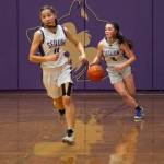 Sequim Gazette photo by Emily Matthiessen / Sequims Hannah Bates, right, looks to push the ball upcourt with teammate Taryn Johnson in the Wolves 70-55 loss to Neah Bay on Feb. 7.