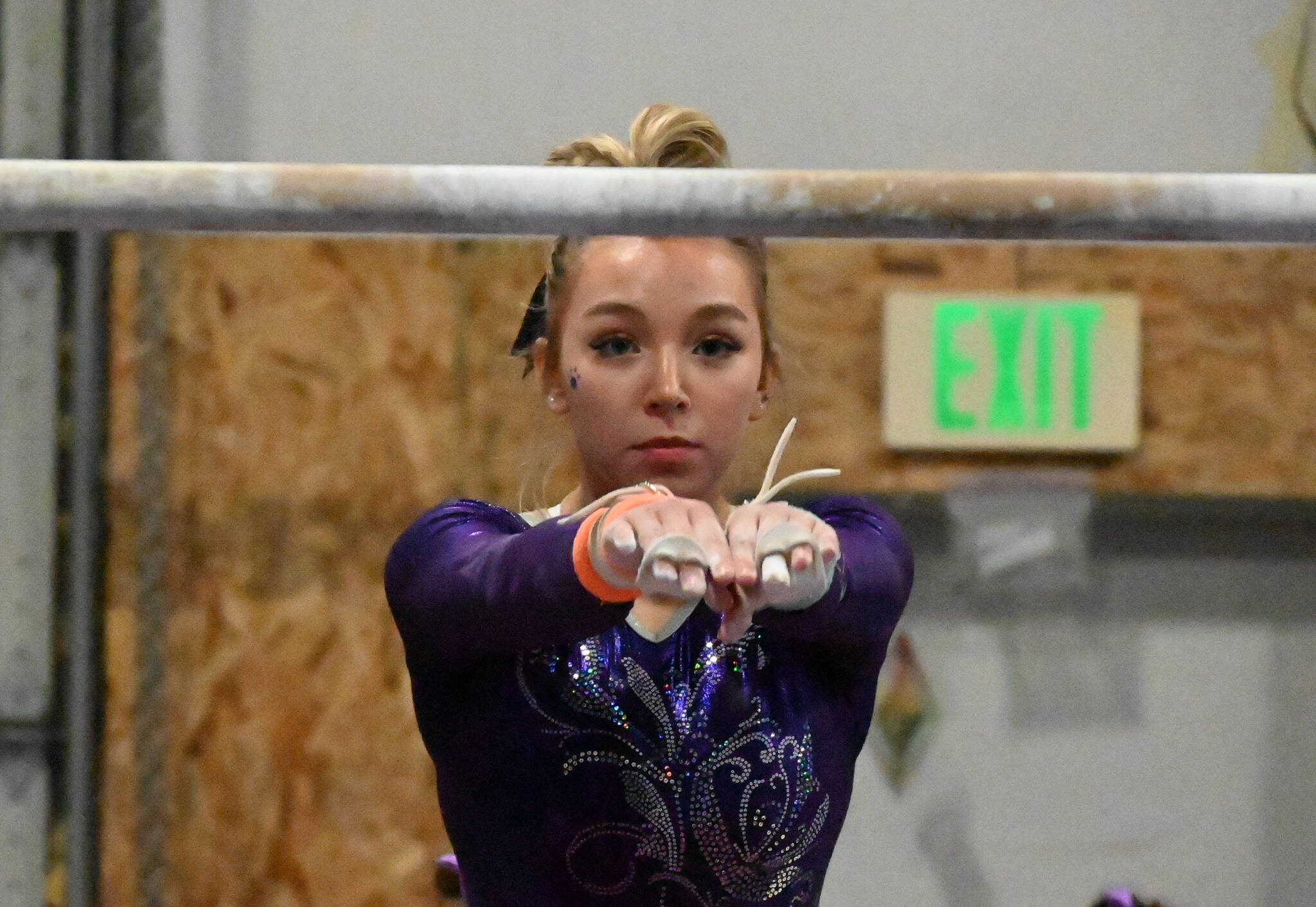 Sequim Gazette file photo by Michael Dashiell / Sequims Susanna Sharp competes in the bars event at an Olympic League meet in Port Angeles on Jan. 11.