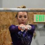 Sequim Gazette file photo by Michael Dashiell / Sequims Susanna Sharp competes in the bars event at an Olympic League meet in Port Angeles on Jan. 11.