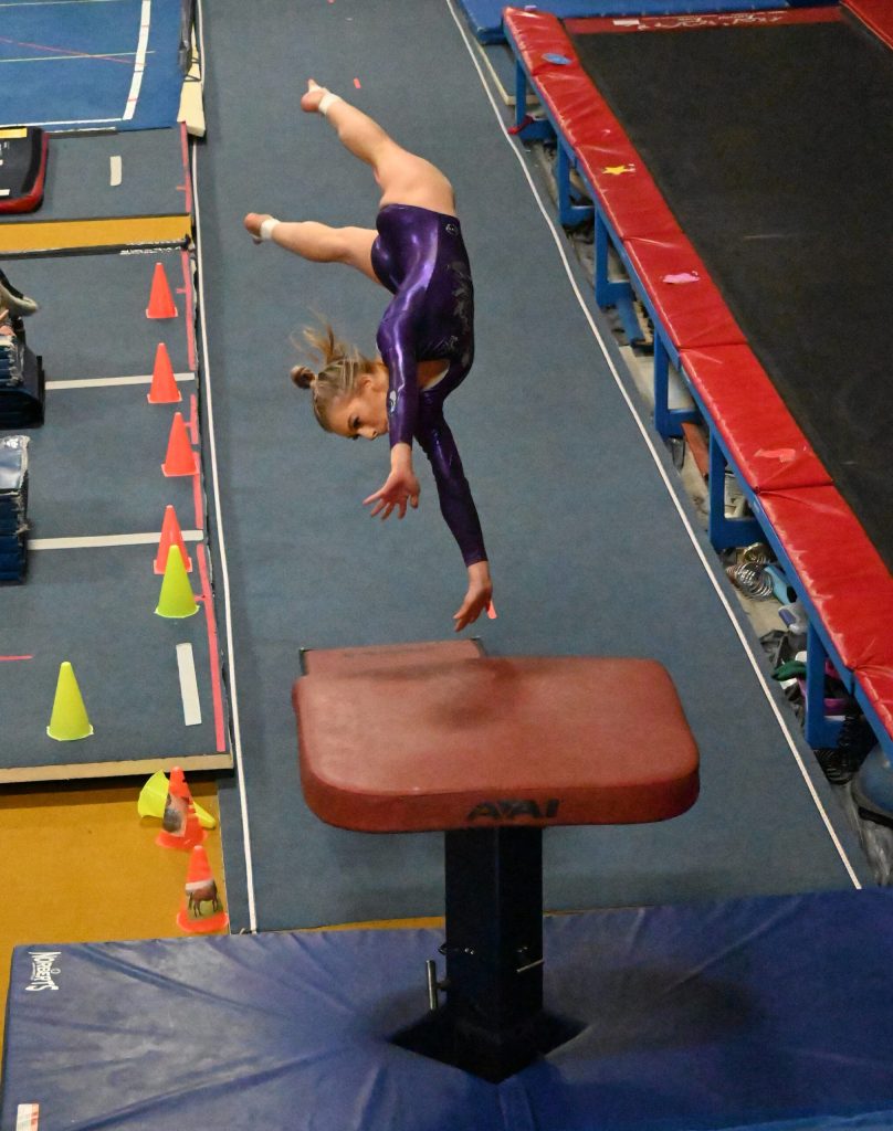 Sequim Gazette file photo by Michael Dashiell / Sequims Kori Miller competes in the vault at an Olympic League meet in Port Angeles on Jan. 11. Miller qualified for the state 2A/3A meet in both vault and bars events.
