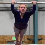 Sequim Gazette file photo by Michael Dashiell / Sequims Lucy Spelker competes in the bars event at an Olympic League meet in Port Angeles on Jan. 11. The freshman qualified for the state 2A/3A meet, set for Feb. 23-25, in the vault after posting a qualifying score at districts last week.