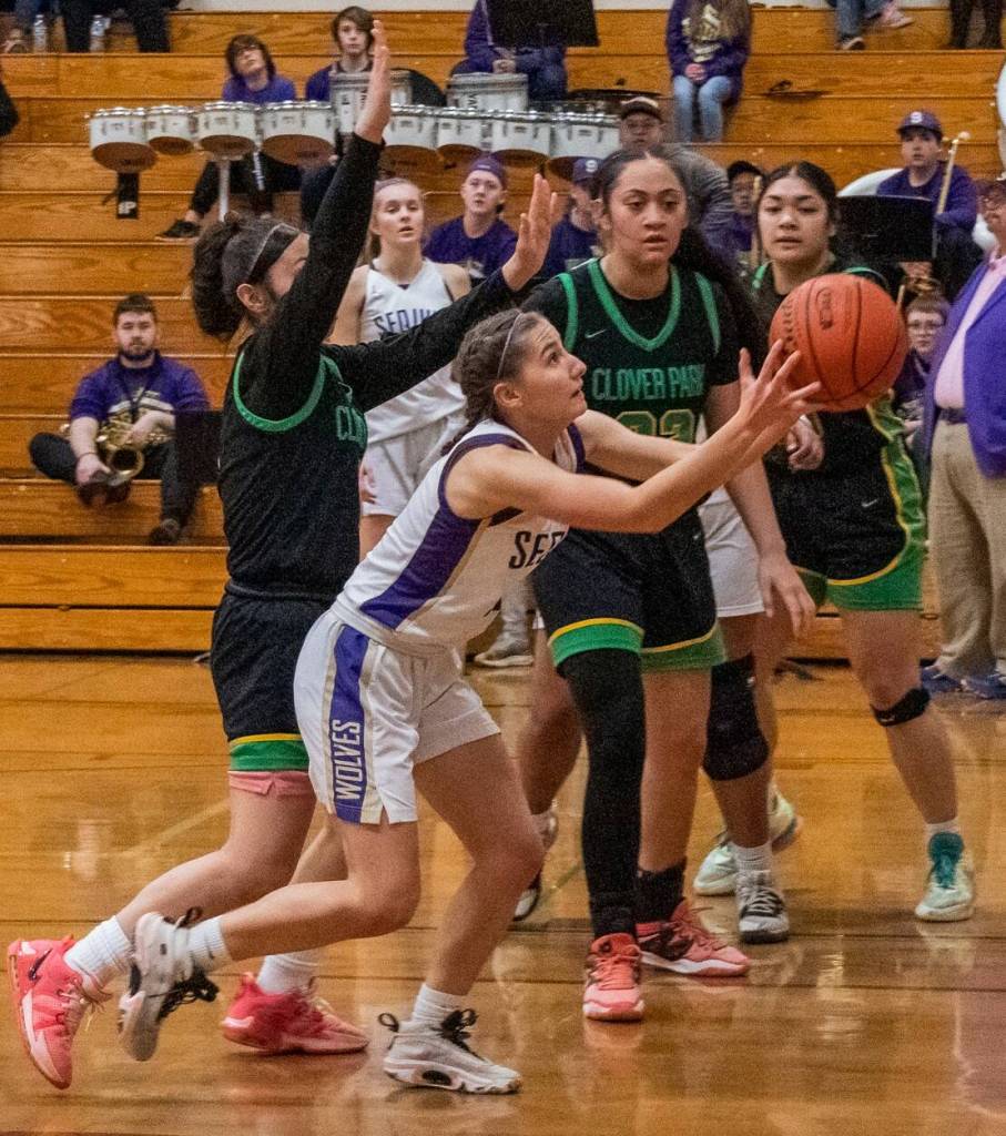 Sequim Gazette photo by Emily Matthiessen / Sequim guard Taryn Johnson looks to keep possession in the Wolves district tourney-opening win over Clover Park at home on Feb. 14.