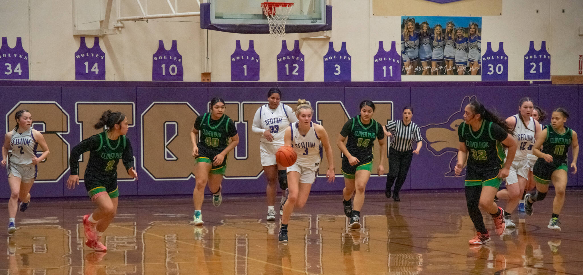 Sequims Jolene Vaara, center, pushes the ball upcourt in the Wolves 65-29 win over Clover Park in the West Central District tournament opener on Feb. 14.