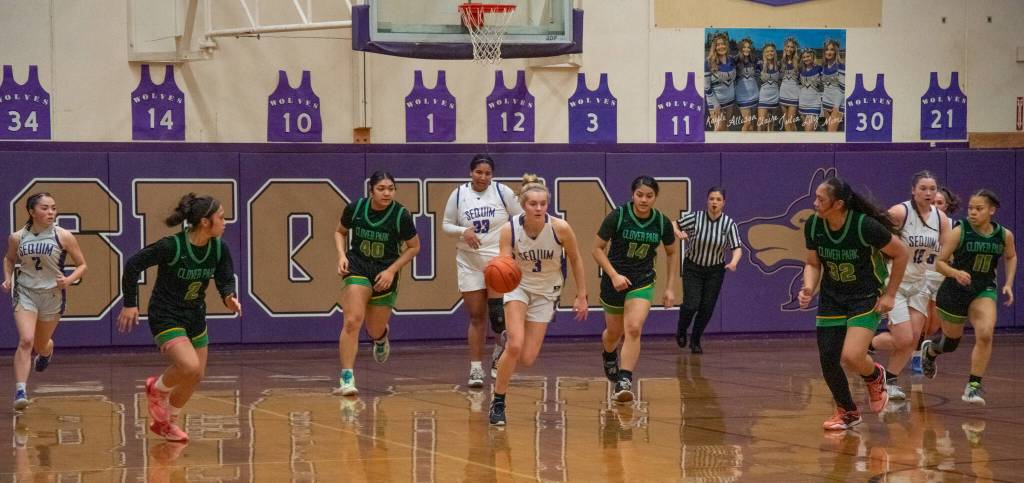 Sequims Jolene Vaara, center, pushes the ball upcourt in the Wolves 65-29 win over Clover Park in the West Central District tournament opener on Feb. 14.