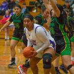 Sequim post Jelissa Julmist looks to score as Clover Parks Alicia-Ellalynn Soliai defends the basket in Sequims 65-29 district tourney win on Feb. 14. Julmist had 13 points, five rebounds and four steals in the victory.