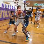 Sequim Gazette photo by Emily Matthiessen / Sequims Brett Mote, center, looks to pass as hes pressured by Lindberghs Dylan Villez, left, and John Chuol in a Feb. 15 West Central District tournament game.