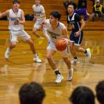 Sequim Gazette photo by Emily Matthiessen / Sequims Isaiah Moore, center, looks to push the ball upcourt as teammates Brett Mote (22) and Vince Carrizosa (14) follow the play, in a West Central District game against Lindbergh on Feb. 15.