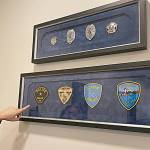 Sequim Gazette photo by Matthew Nash
Since 1913, Sequim Police Department has had four badges and patches, including one badge only worn in 2013 for Sequims Centennial Celebration. A new, fifth badge was designed and agreed upon by officers over the last three years and recently integrated into uniforms in late January 2023.