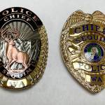Sequim Gazette photo by Matthew Nash/ Sequim Police Department recently switched to a new badge that features an elk, mountains, sun and laurels (reminiscent of lavender) to show features more of the area rather than the previous, more generic badge.