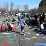 Sequim Gazette photo by Michael Dashiell/ Visitors to Carrie Blake Community Park on March 4 are invited to use provided paint and brushes to make designs that will last the year as part of the Sequim Sunshine Festivals street mural project.