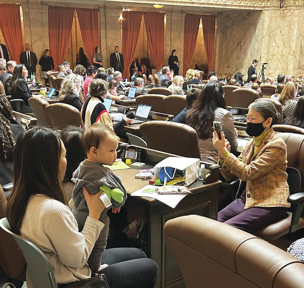 Photo courtesy of WNPA News Service / Childrens Day in the state Legislature last week fills the House chamber with children and grandchildren to witness passage of legislation naming a state dinosaur.