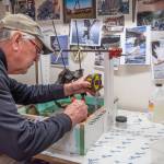 Sequim Gazette photo by Emily Matthiessen
Molly Omanns mentor, Don Meyer, measures for the next epoxy pour. The pair pour an inch at a time, waiting 24 hours for the layer to dry before pouring another layer.