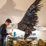 Sequim Gazette photo by Emily Matthiessen
Local driftwood artist Molly Omann puts some of the finishing touches on her latest effort, Fisher King  a 57-inch-tall bald eagle that she calls her most challenging piece.