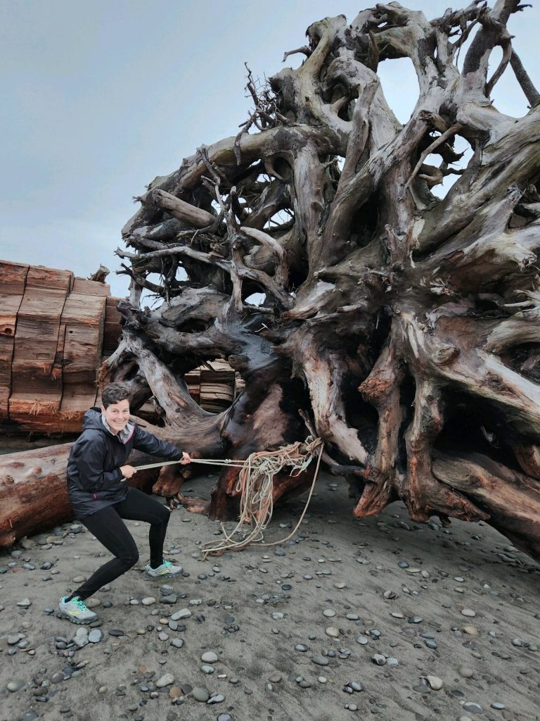 Photo courtesy of Molly Omann
Molly Omann, driftwood artist, visits the beach.