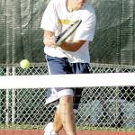 Sequim Gazette file photo by Michael Dashiell / Sequim High School senior Kyle McKenzie returns a shot in an October 2003 match.