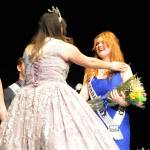 Sequim Gazette photo by Matthew Nash/ Princess Anne Marie Barni, right, learns shes awarded the Congeniality Award on Feb. 25, sponsored by Castell Insurance, for her kindness to fellow contestants during the pageant preparation process. Last years winner, queen Isabella Williams, presented her the award. This years Sequim Irrigation Festival royal court includes, from left, prince Fred Cameron, princess Anne Marie Barni, queen Pepper Reymond, and princess Paige Skylar Krzyworz. Theyll tour the region extensively this summer in parades representing Sequim as ambassadors.