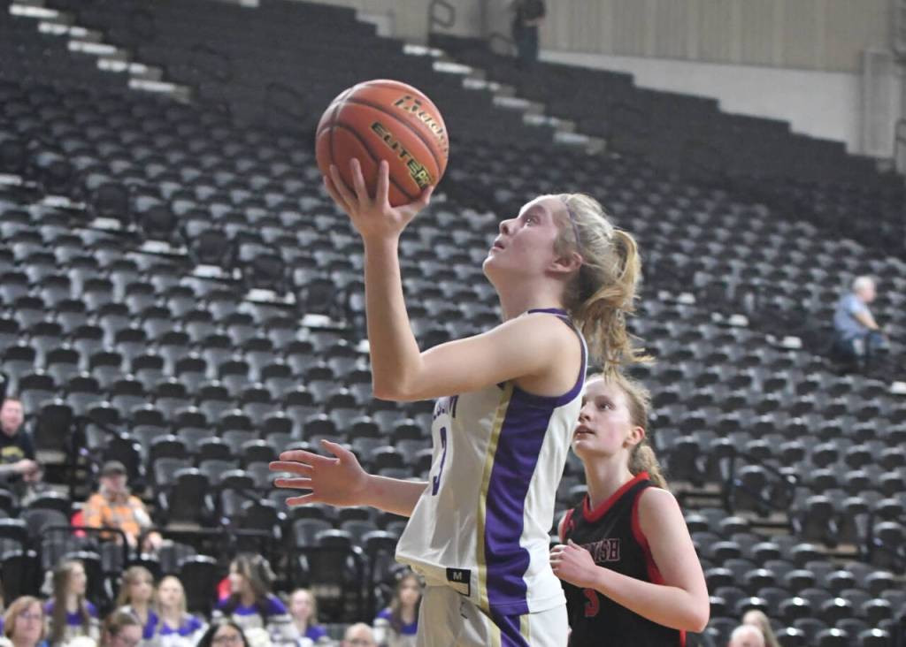 Photo by Jim Heintz / Sequims Jolene Vaara, left, drives to the basket in the second half of the Wolves 57-37 win over Sammamish in the class 2A state tournament in Yakima on March 1. Vaara had 16 points in the 57-37 SHS victory. Looking on is Sammamishs Katie Anderson.