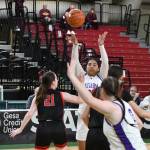 Photo by Jim Heintz / Sequims Jelissa Julmist, background, passes to teammate Sammie Bacon in the first half of the Wolves 57-37 win over Sammamish on March 1, in a Round of 12 game of the class 2A state tourney in Yakima.