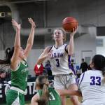 Photo by Jim Heintz /With teammate Jelissa Julmist (33) looking on, Sequims Jolene Vaara rises up for a shot in the Wolves 38-24 win over Tumwater at the class 2A state tournament on March 3. Defending on the play are Tumwaters Morgan Simmons (4) and Kylie Waltermeyer.