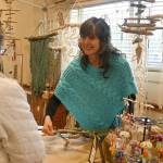 Shelly Weber of PNW GIRL chats with customers at the Sunshine Market inside the Guy Cole Event Center on March 4.