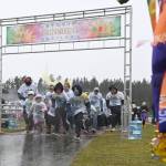 Runners and walkers in the Sun Fun Color Runs 1k event break from the starting line at the Albert Haller Playfields on March 4.