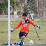 Sequim Gazette photo by Emily Matthiessen / Sophomore Nolan Valenzuela kicks off a drill as the boys varsity soccer team practices at the Albert Haller Playfields in Carrie Blake Community Park last week.
