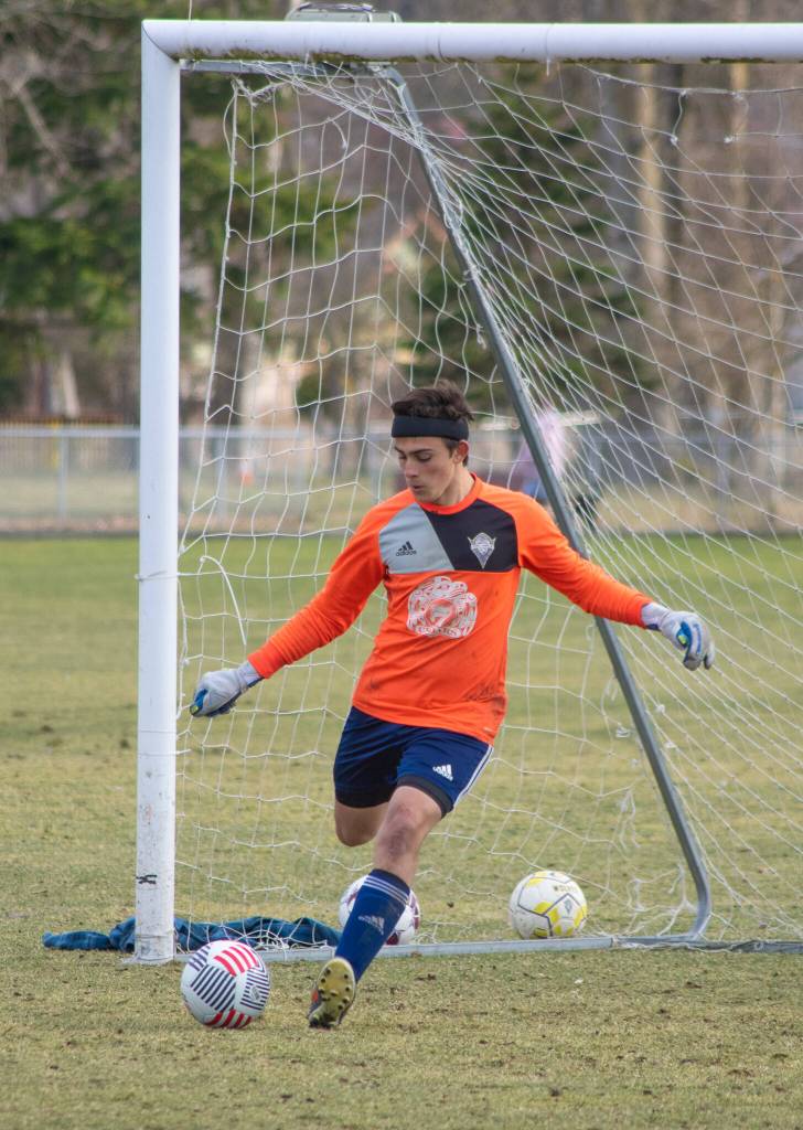 Sequim Gazette photo by Emily Matthiessen / Sophomore Nolan Valenzuela kicks off a drill as the boys varsity soccer team practices at the Albert Haller Playfields in Carrie Blake Community Park last week.