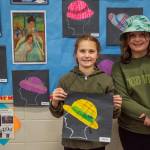 Sequim Gazette photo by Emily Matthiessen / Friends Addie Slezak, left, and Lily Sanford said they both really liked the Meet the Masters art class. Slezak holds her Mary Cassatt inspired art piece. It helped you express yourself, she said. Sanford said, It was great. It showed you want you wanted to do in art.