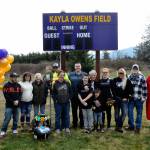Sequim Gazette photo by Matthew Nash/ Family members of Kayla Owens gather for a photo after a Sequim Little League ceremony dedicating the new Kayla Owens Field on March 19.