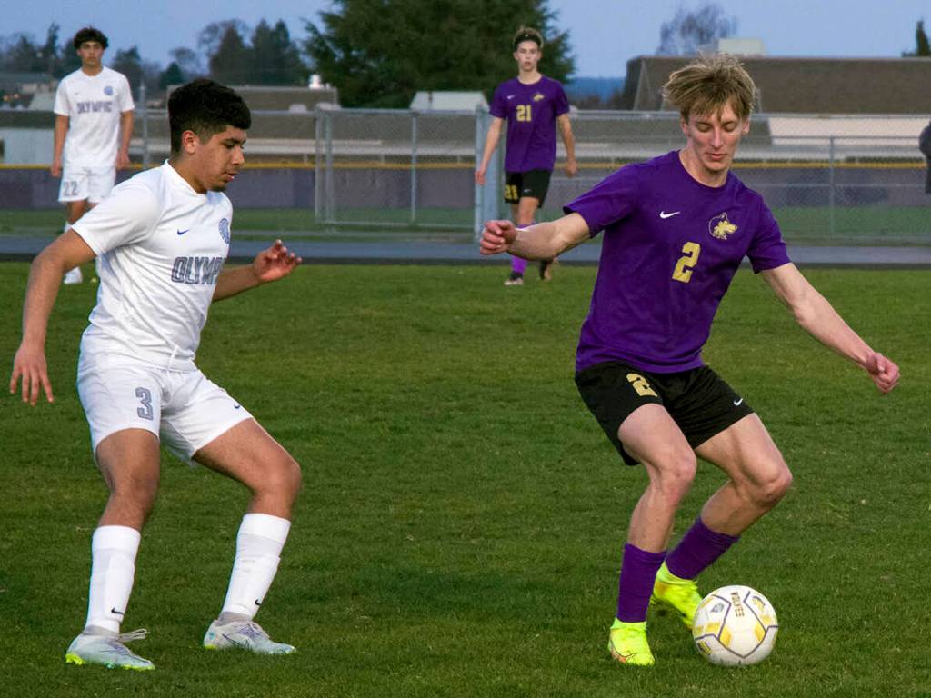 Sequim Gazette photo by Emily Matthiessen / Sequims Nova Barrett, right, looks to keep possession in a home match-up against Olympic on March 21. The Wolves edged the Trojans, 1-0.