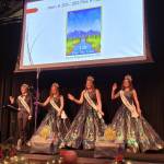 Sequim Gazette photo by Michael Dashiell / Sequim Irrigation Festival royalty (from left) prince Fred Cameron, princesses Anne Marie Barni and Skylar Krzyworz, and queen Pepper Reymond, perform their festival song for the first time, at the festivals kickoff dinner and auction on March 25.