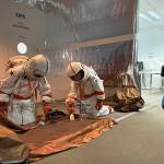 Sequim Gazette photo by Matthew Nash/ Third grade geologists Atreus Parker and Zische Sylvester uncover rock specimens during an interactive lesson on Mars in Michele Canepas class.