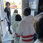Sequim Gazette photo by Matthew Nash
Michele Canepa leads third grade astronauts out of Olympic Peninsula Academys office to her classroom for their Mission to Mars on March 27.