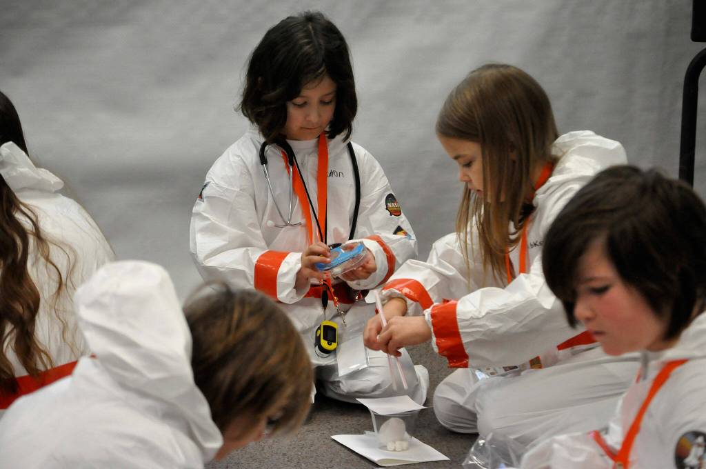 Sequim Gazette photo by Matthew Nash/ Students build egg drop devices as part of a soft landing exercise for their spaceship in Michele Canepas third grade class.