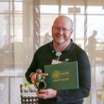 Photo courtesy of Olympic Medical Center
Registered nurse John Petrisin-Connelly accepts his Daisy Award for Extraordinary Nurses.