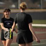 Sequim Gazette photo by Michael Dashiell / Sequims Amara Gonzalez and Payton Smithson congratulate each other after winning a point in their No. 2 doubles match against Port Angeles Kayla Jones and Bridget Weed on March 29. Gonzalez and Smithson won their match, 6-3 and 6-1.