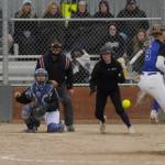 Sequim gazette photos by Michael Dashiell
Sequims Lexi King, center, hits a run-scoring single off North Mason pitcher Alissa DiMatteos foot in the sixth inning of a 10-8 home win over the Bulldogs on March 30.
