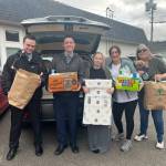 Photo courtesy of WaFd Bank (Sequim) / Sequims WaFd Bank recently collected and delivered 208 items to Healthy Families of Clallam County through a donation drive held in March. Pictured, from left, are: Sequim WaFd personal bankers Will Mounts and Hunter Deford; Jo Anne Clark, receptionist for Healthy Families of Clallam County; Stephanie Sullivan, Healthy Families of Clallam County crime victim advocate/legal advocate); Tracy Caldwell, Healthy Families of Clallam County deputy executive director, and puppy Lily, Healthy Families of Clallam Countys mascot.