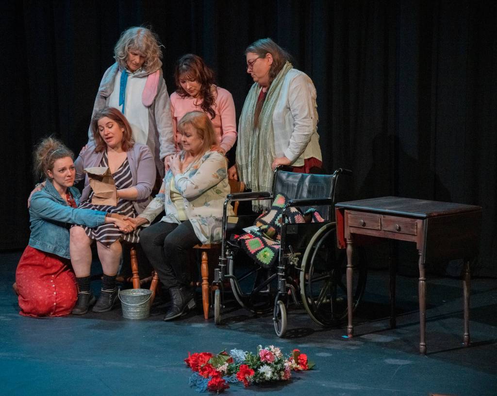 Sequim Gazette photo by Emily Matthiessen / Front, from left to right, Merrin Packer, Taryn Dupont, Cheryl DiPietro, and behind, Cheryl Tamblyn, Jamie Pauley and Amy Henry participate in a poignant scene in Calendar Girls, Olympic Theatre Arts newest production, scheduled to run from April 28 to May 14.