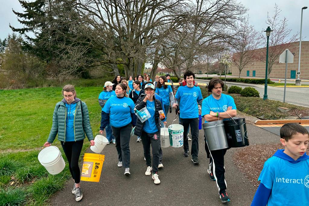 Photo courtesy of ​​Ann Flack/ Sequim Sunrise Rotary
Sequim Interact Club members walk from Sequim Middle School to the Dungeness River for their annual Walk for Water fundraiser. Students carried water about two miles back to the school to raise awareness for those in other countries who walk numerous hours daily to gather water. They also seek funds to build a well in Ghana.