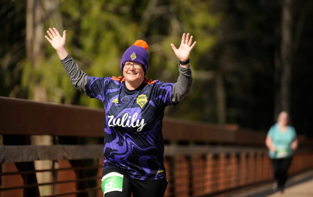 Catherine Knowles celebrates a strong finish in the Railroad Bridge Run 5k on Saturday, April 22, in Sequim.