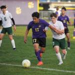 Sequims Abe Torres (17) and Port Angeles Kaleb Gagnon (7) vie for the ball in the first half of an April 18 Olympic League match-up in Sequim. The host Wolves got a first half goal and held on for a 1-0 victory.