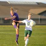 Sequim Gazette photos by Michael Dashiell
Sequims Jack Henninger, left, clears the ball from SHS territory as Port Angeles Matthew Miller pursues the play in an April 18 league match. Sequim won, 1-0.